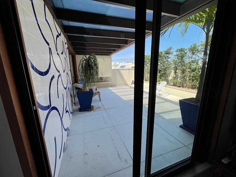 Studio apartment with shared terrace and shower.
