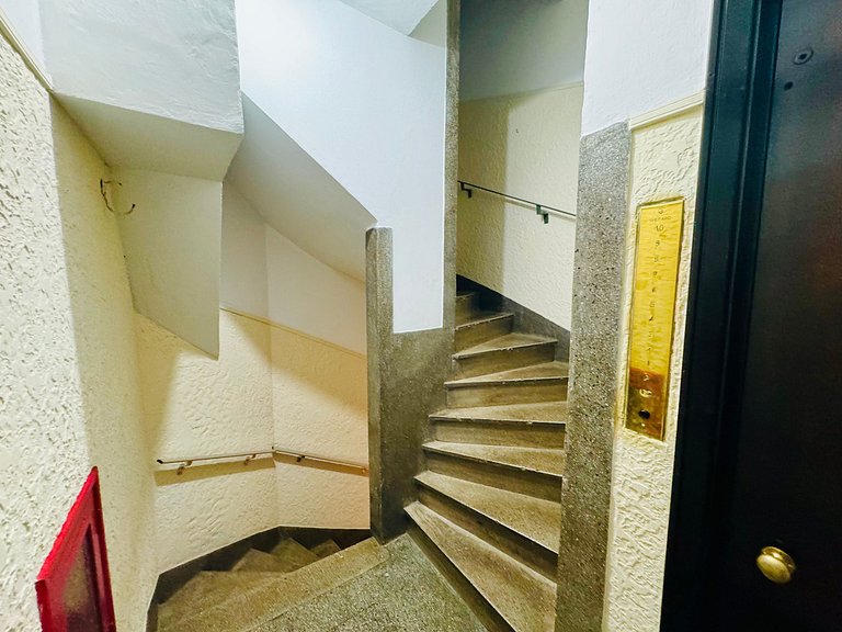 Studio apartment with shared terrace and shower.