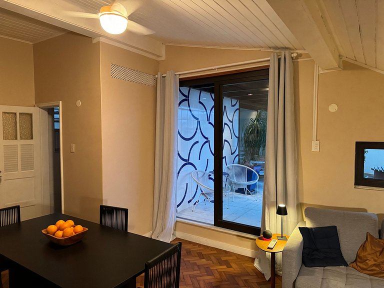 Studio apartment with shared terrace and shower.