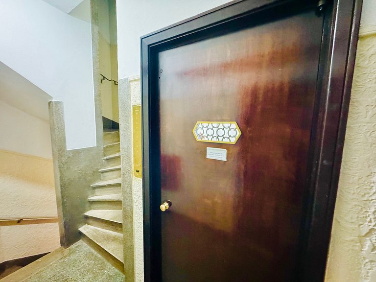 Studio apartment with shared terrace and shower.
