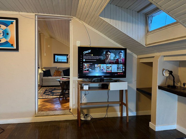 Studio apartment with shared terrace and shower.
