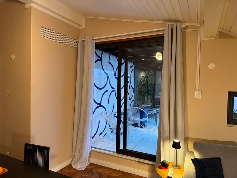 Studio apartment with shared terrace and shower.