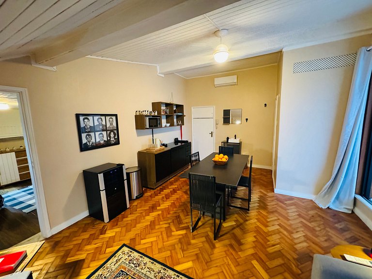 Studio apartment with shared terrace and shower.