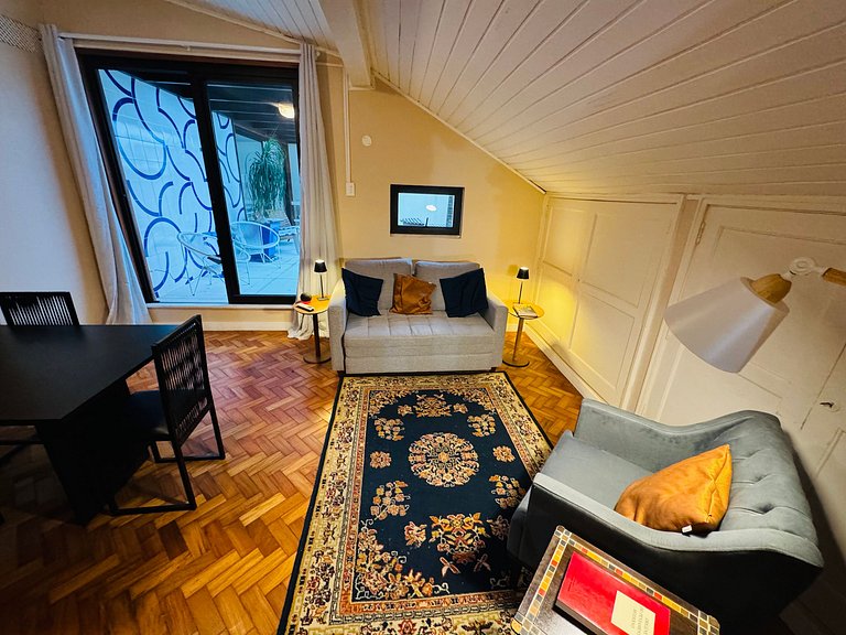 Studio apartment with shared terrace and shower.